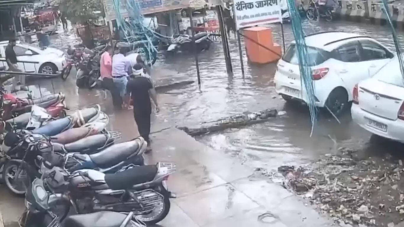 Caught-on-camera--Couple-riding-scooter-fall-into-water-filled-ditch-in-Aligarh